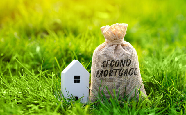Second mortgage concept. Type of mortgage loan that is taken out on a property that already has a first mortgage. Real estate and finance